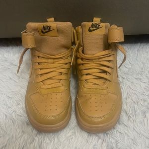 Size 4.5Y high top nike with strap, no sole on the inside of the sneakers